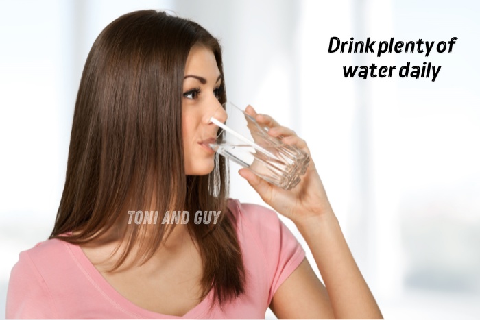 Healthy hair care tip from Toni & Guy Coimbatore highlighting the importance of drinking plenty of water daily