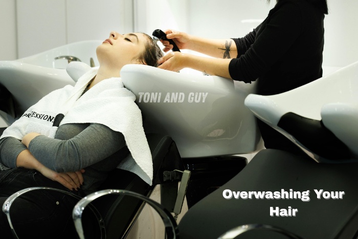 Professional hair wash and scalp care service at Toni & Guy Salon, Coimbatore, highlighting the importance of avoiding over-washing