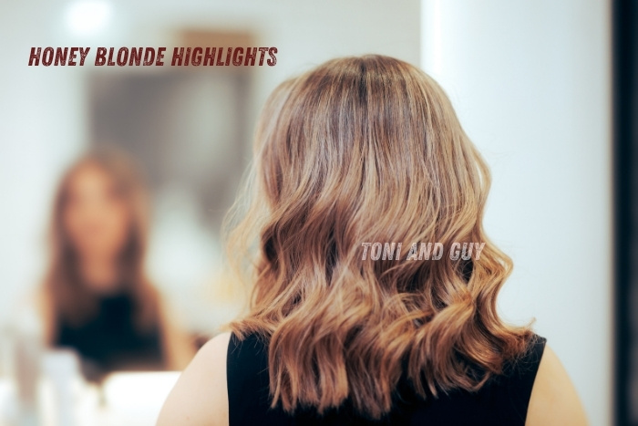 Soft honey blonde highlights adding shine and dimension, done at Toni & Guy Coimbatore hair salon